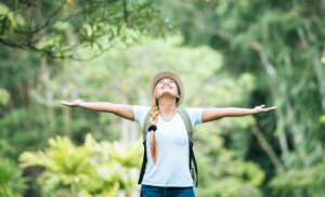 A woman looking extremely happy, inspiring the question, "Does money buy happiness?"