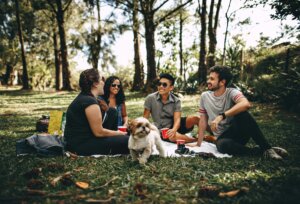 A group of friends is seen hanging out with eachother.