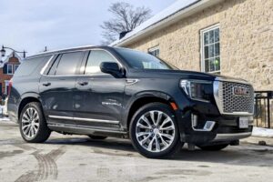 A GMC Yukon Denali sport utility vehicle on a driveway