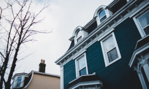 Exterior view of the upper floor of a home on a cloudy fall day