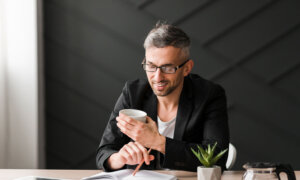 A man reading a course about retirement planning