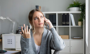 A woman on her phone trying to get the money back from a scam.