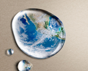 Artistic image of the earth magnified in a drop of water